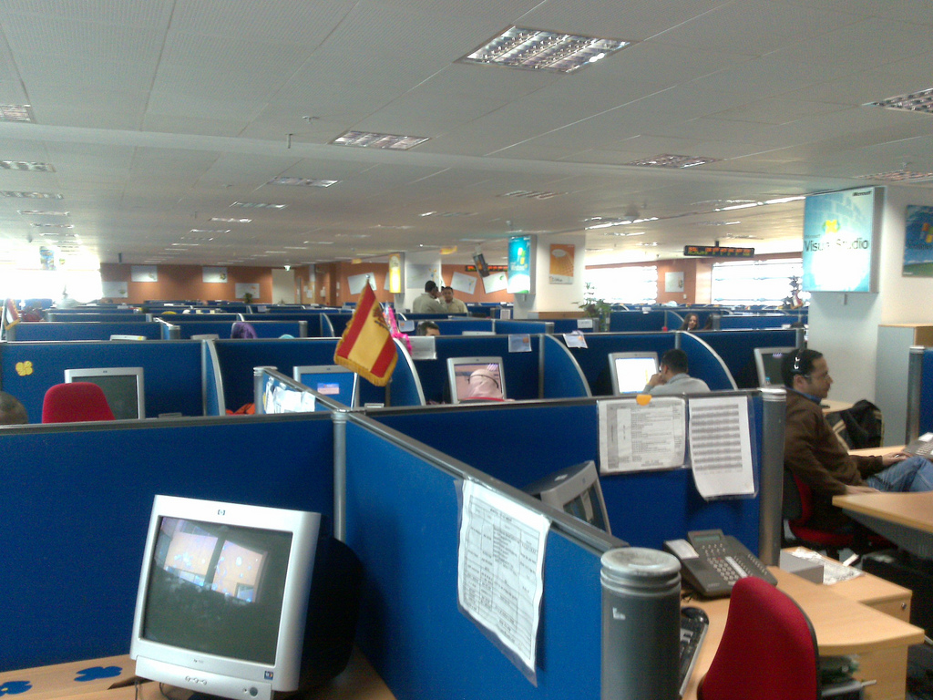 Rows of cubicles inside a call center company