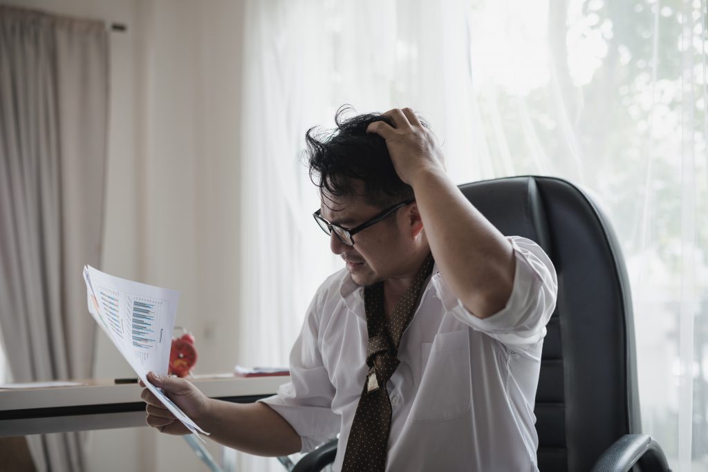 A frustrated businessman rushing to hire virtual assistants
